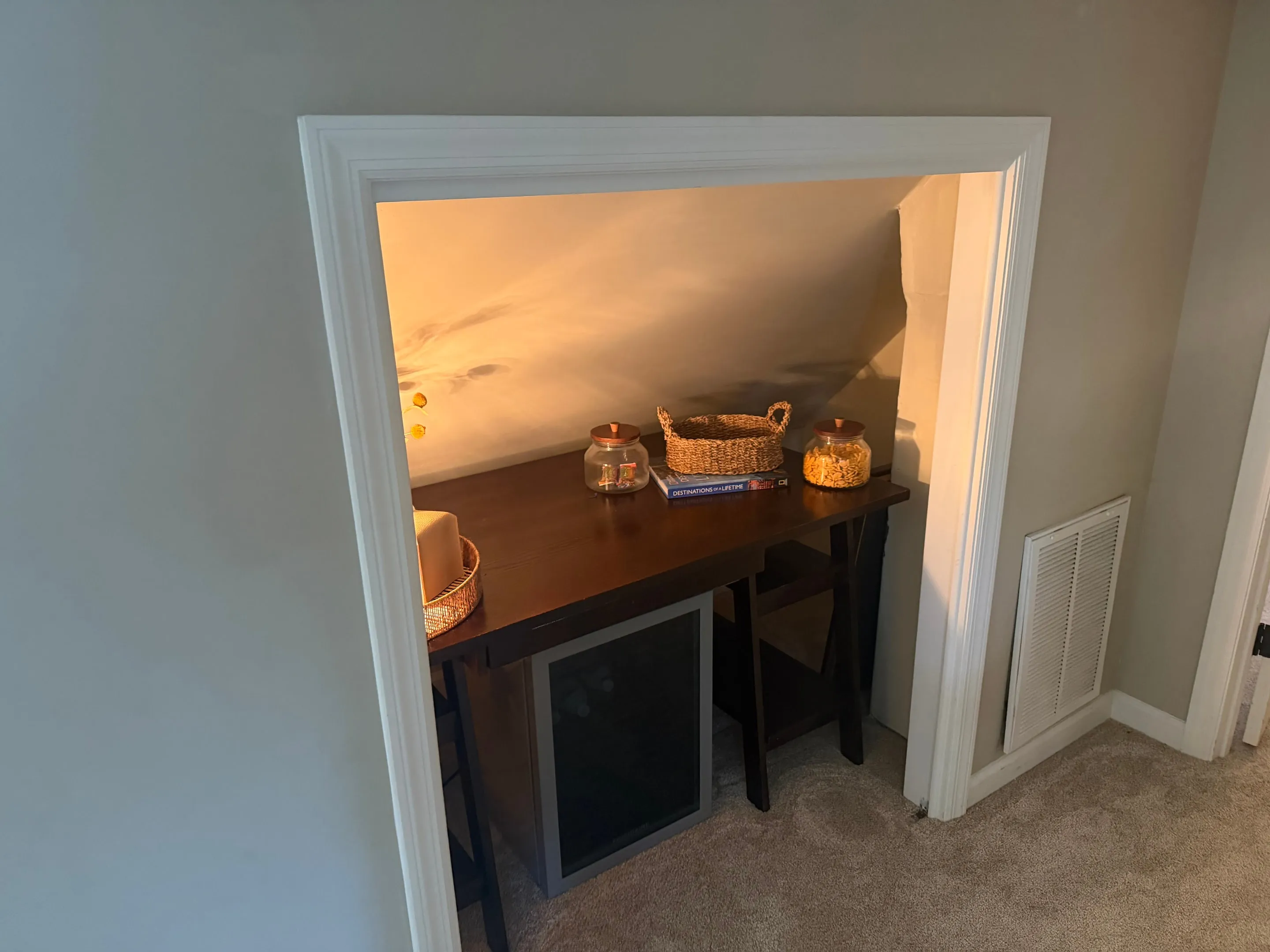 Small alcove under the eaves with a table.
